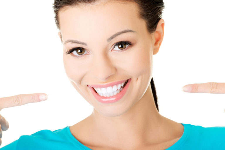 Beautifull women showing her perfect white teeth