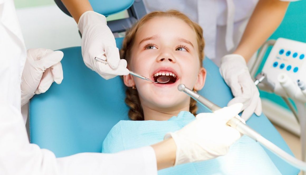 Little girl smiling at dentist check up